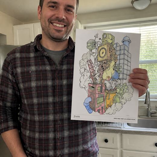 Real Journey Engine customer holding a page they hand-coloured