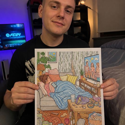 Real Journey Engine customer holding a page they hand-coloured