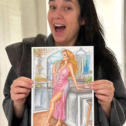 Real Journey Engine customer holding a page they hand-coloured