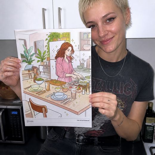Real Journey Engine customer holding a page they hand-coloured
