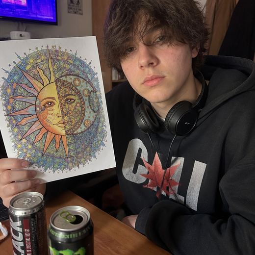 Real Journey Engine customer holding a page they hand-coloured