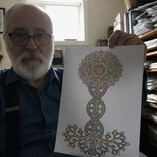 Real Journey Engine customer holding a page they hand-coloured